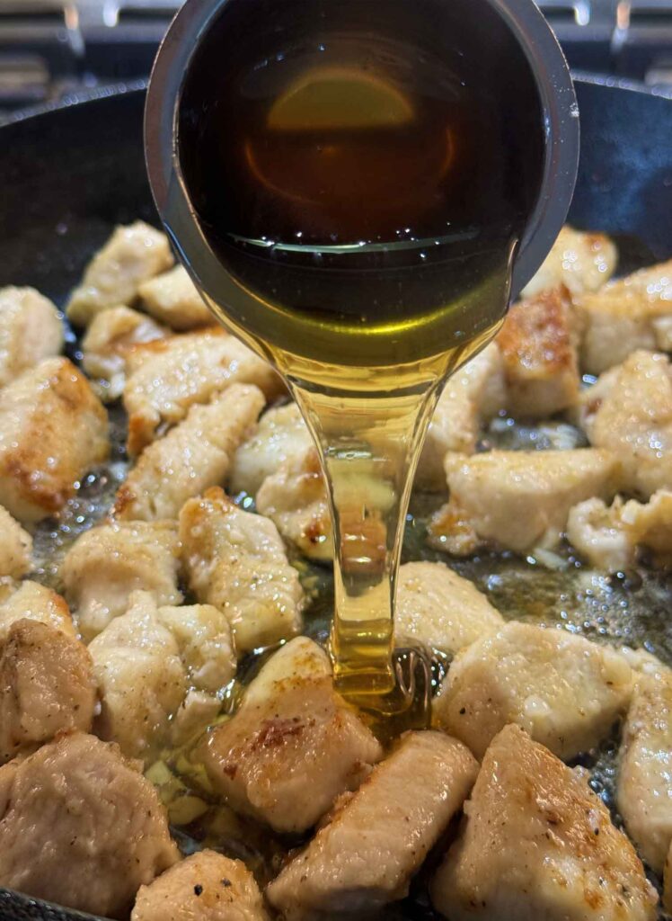 Pouring honey on chicken