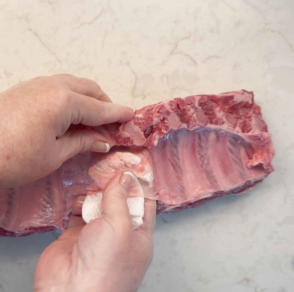 Inserting paper towel between the membrane and meat