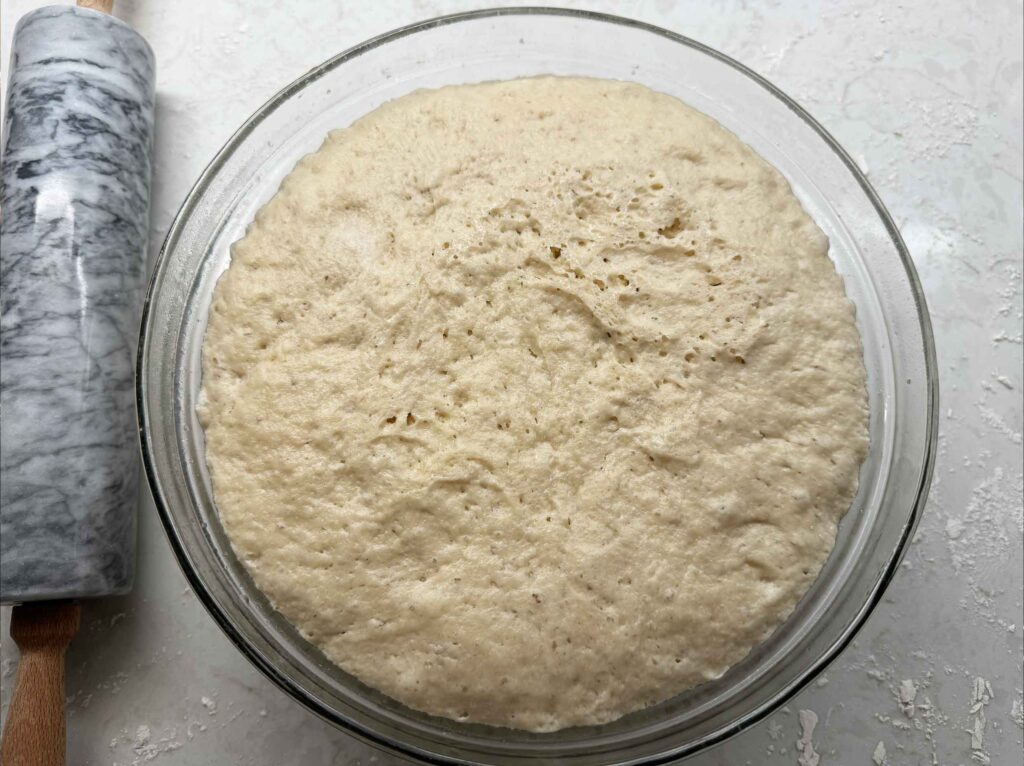 Dough in bowl that has risen.