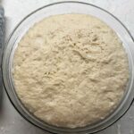 Dough in bowl that has risen.