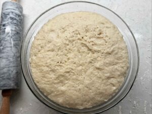 Dough in bowl that has risen.