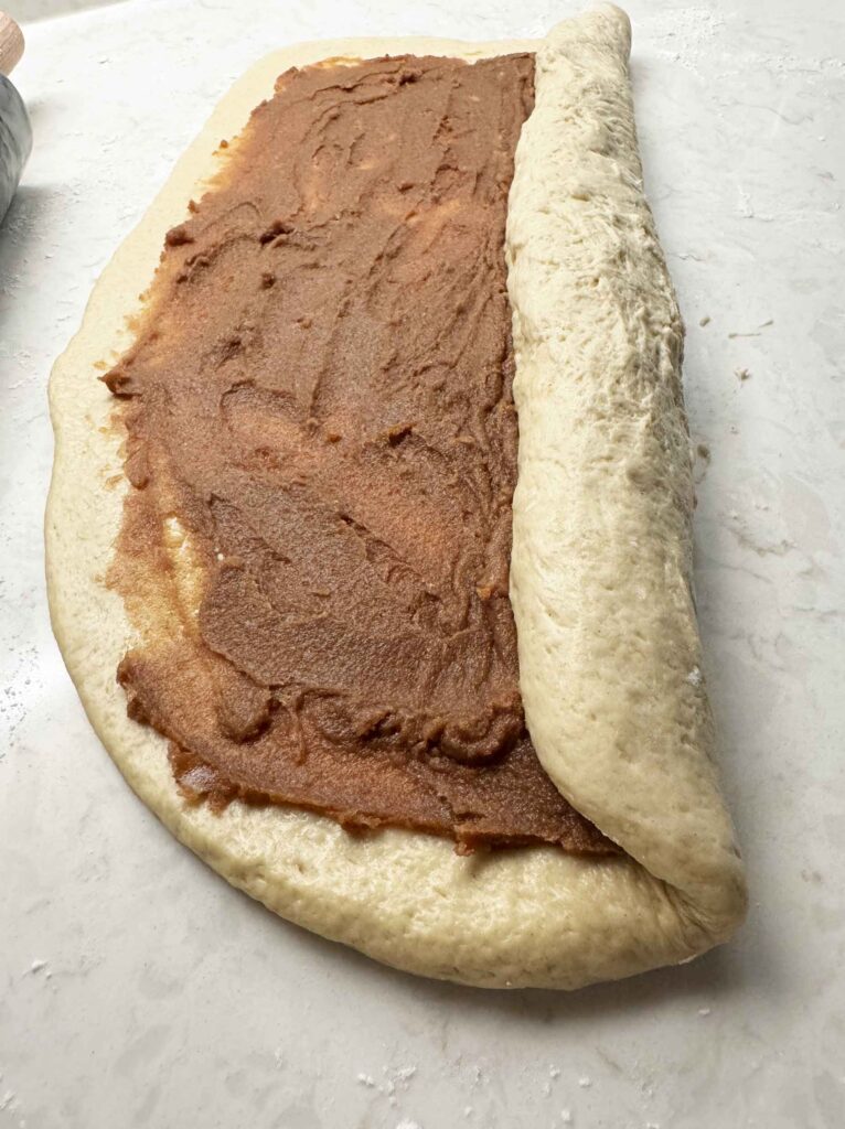 Rolling up the dough with the filling inside