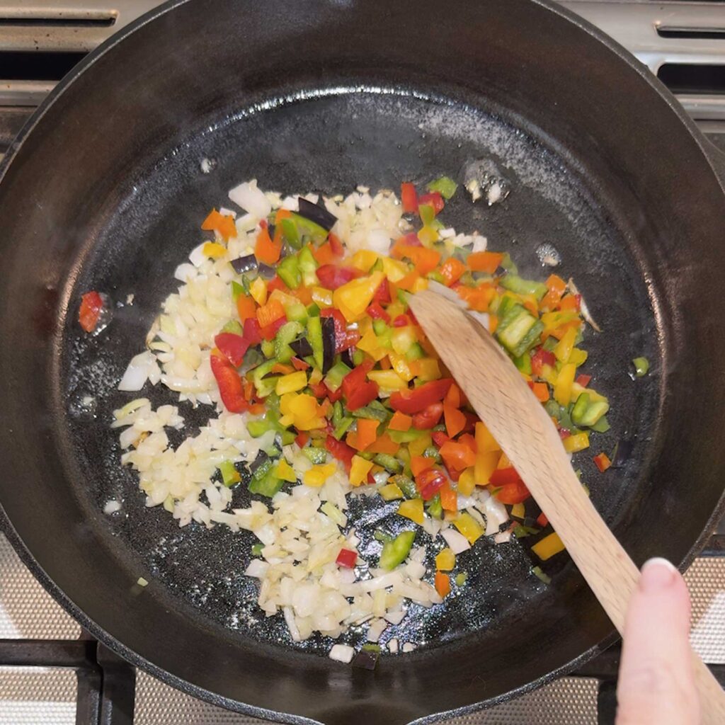 sauteeing the vegetables for the crustless quiche