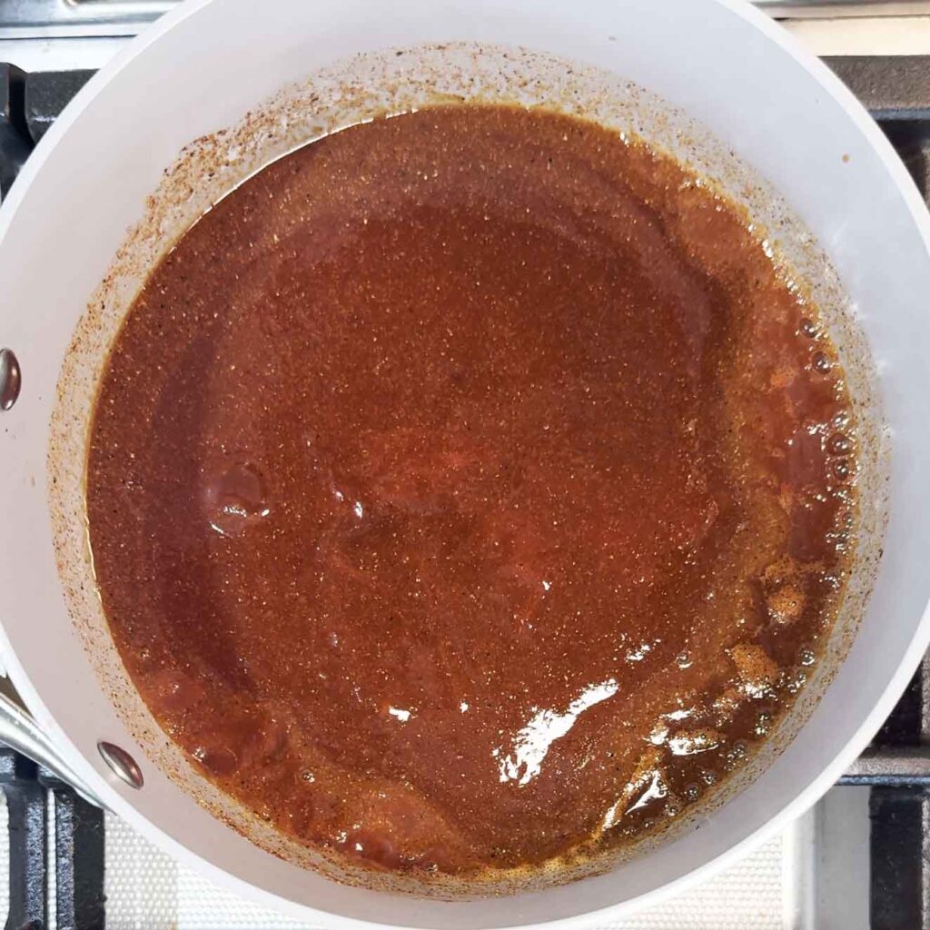 Simmering the homemade bbq sauce in a saucepan