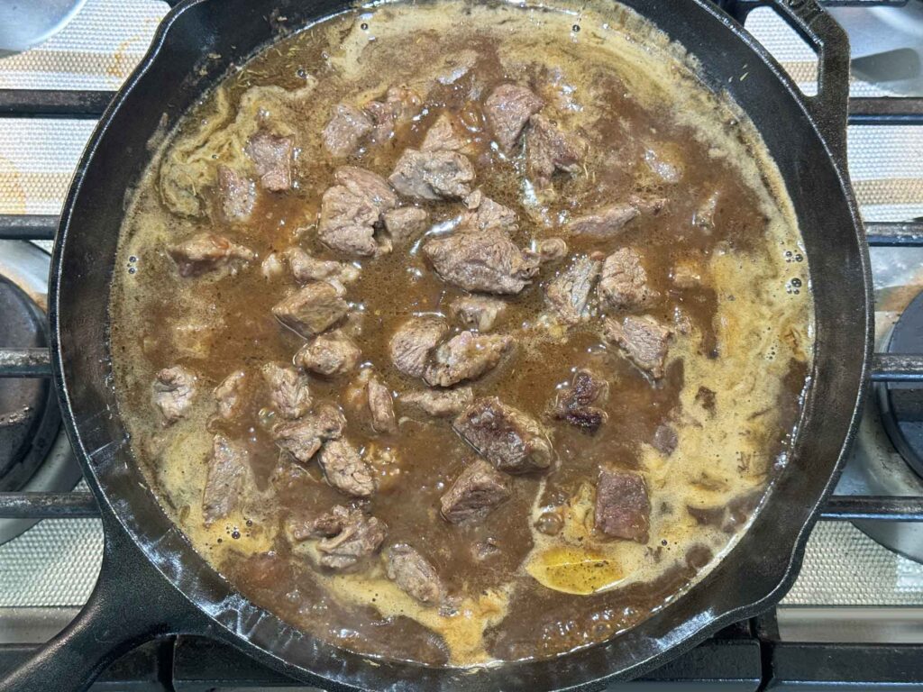 simmering beef in skillet