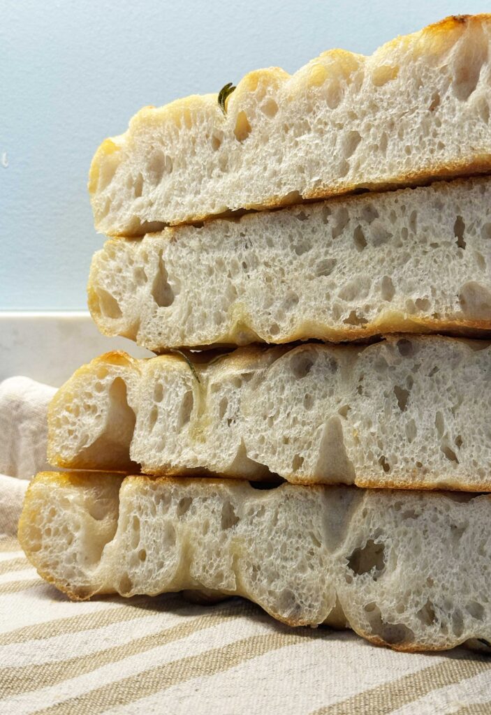 Slices of sourdough focaccia bread, airy and light