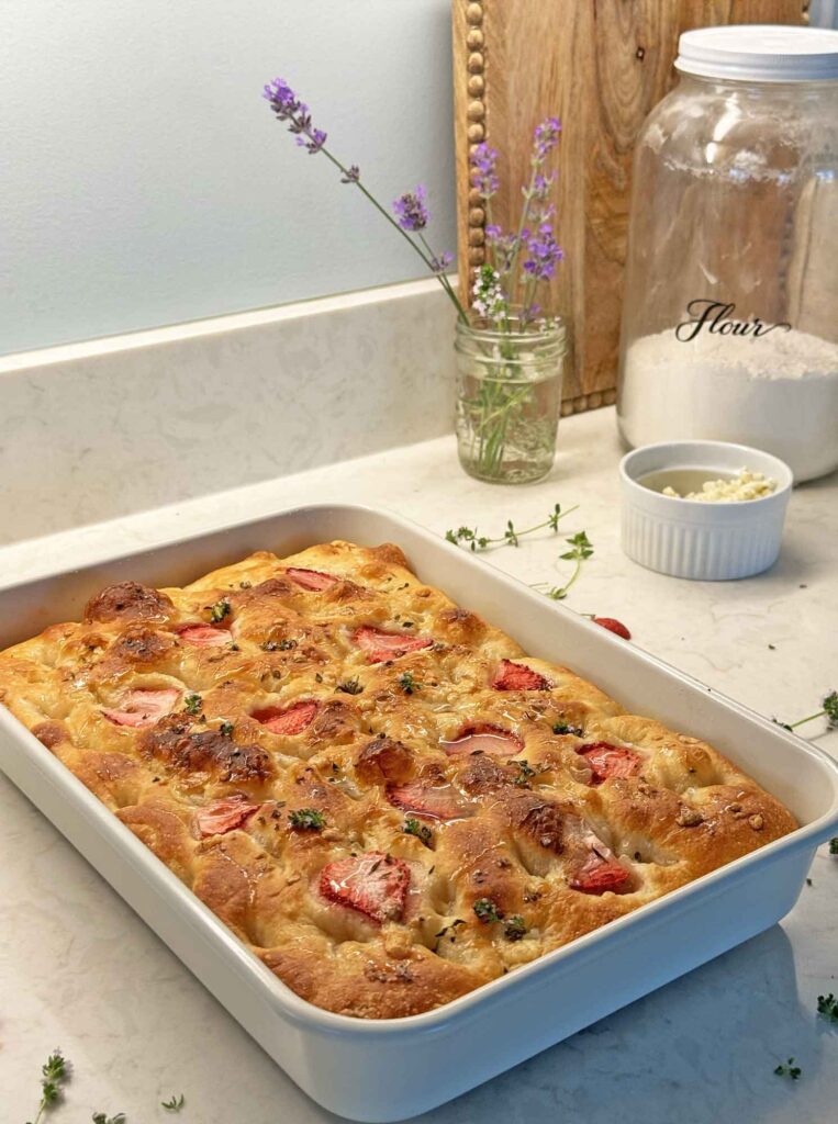 Sourdough focaccia with strawberries, thyme, blue cheese, and honey
