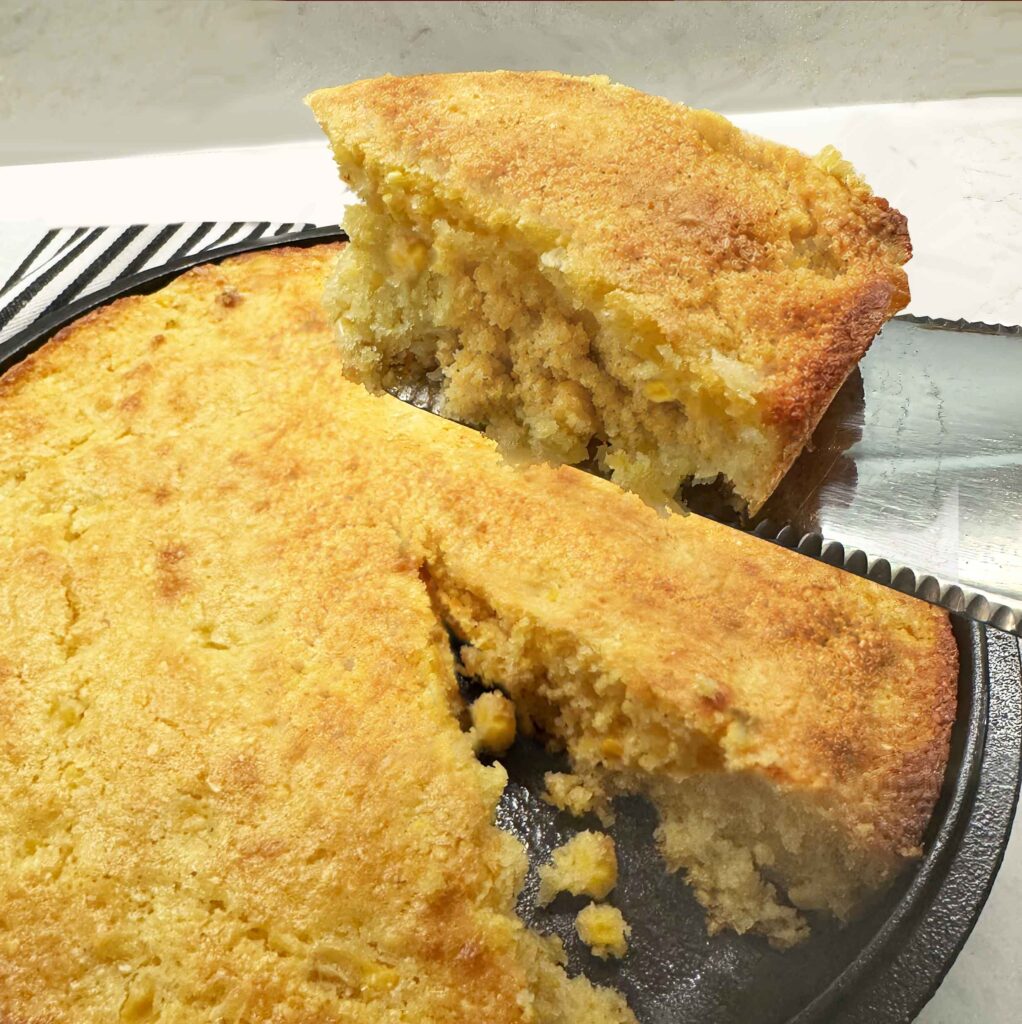 Piece of sweet cornbread from a skillet