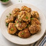 A bowl of turkey meatballs sprinkled with fresh parsley