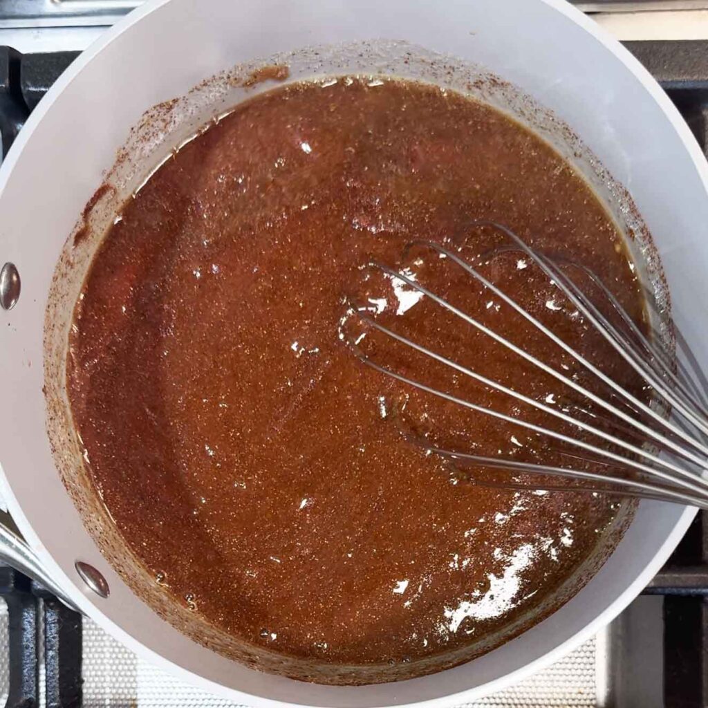 Whisking together the BBQ sauce ingredients in a saucepan
