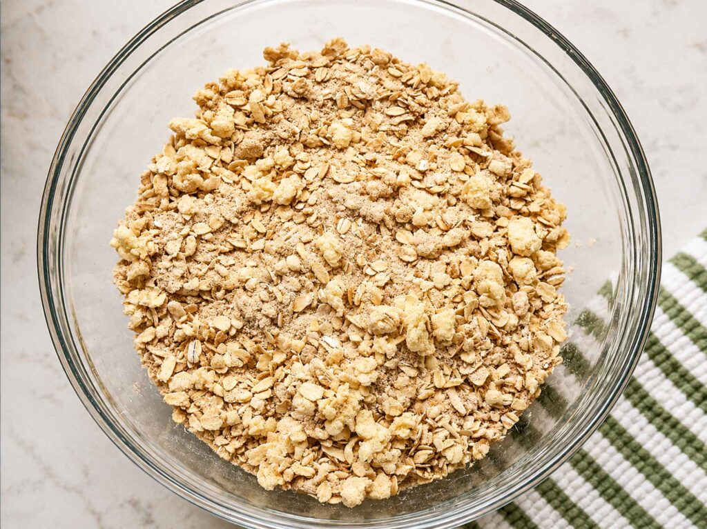 Buttery oat crumble topping for apple crisp in a bowl
