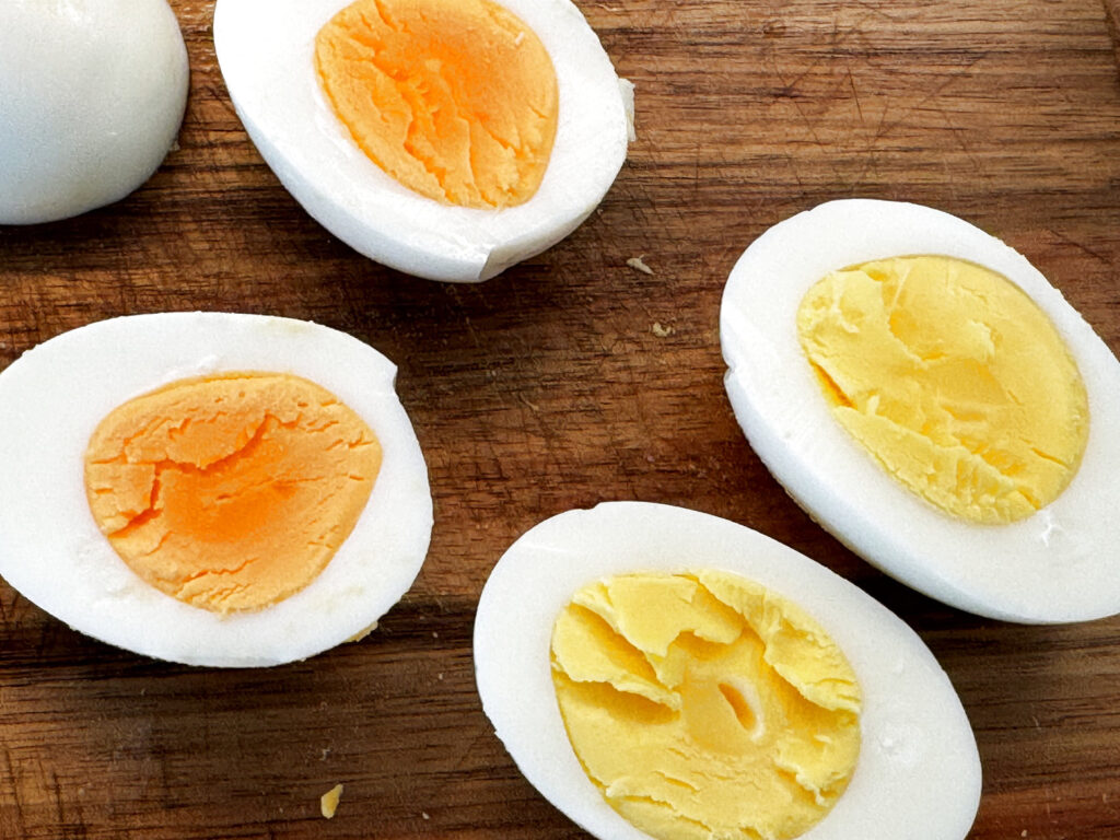 Halved hard-boiled eggs showing tender, fully set yolks