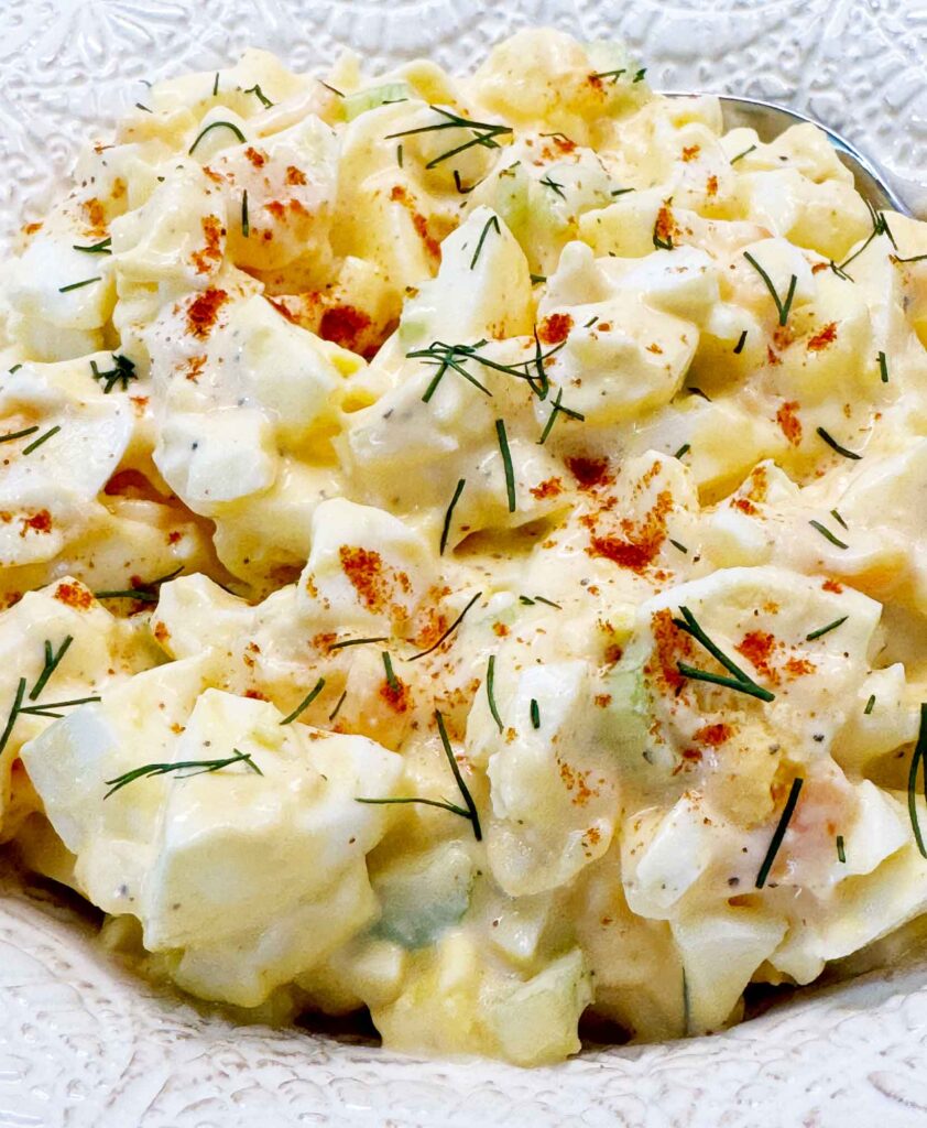 Egg salad with paprika and fresh dill closeup