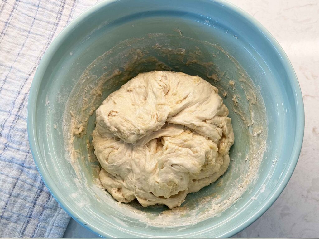 Sourdough pizza dough with olive oil, folded over onto itself 8-10 times