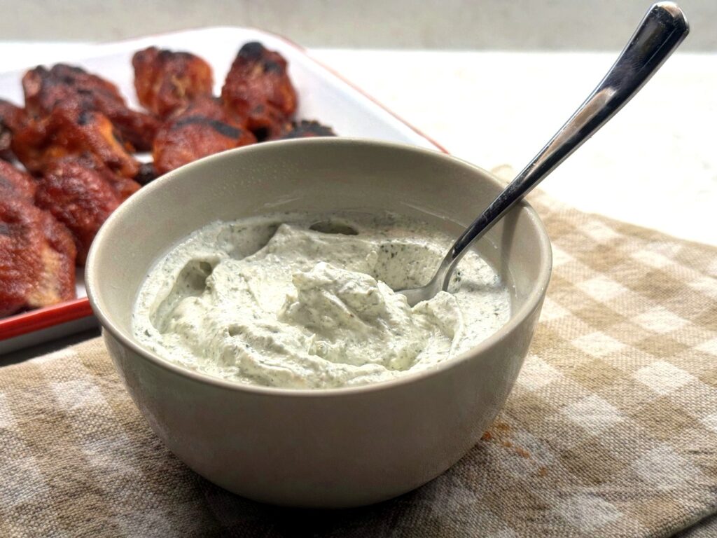 A bowl of homemade ranch dip make from ranch seasoning and sour cream