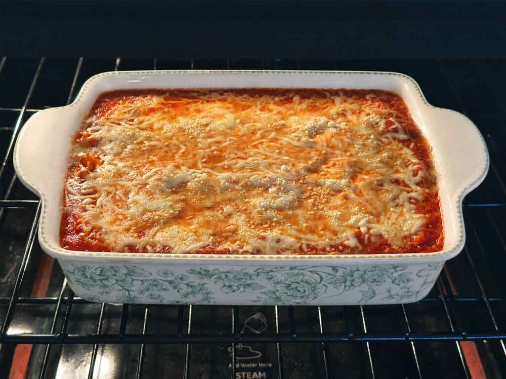 Melty, cheesy lasagna baking uncovered the last 15 minutes in the oven