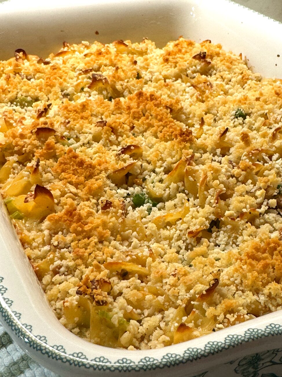 Baked tuna noodle casserole with a golden, crispy breadcrumb topping