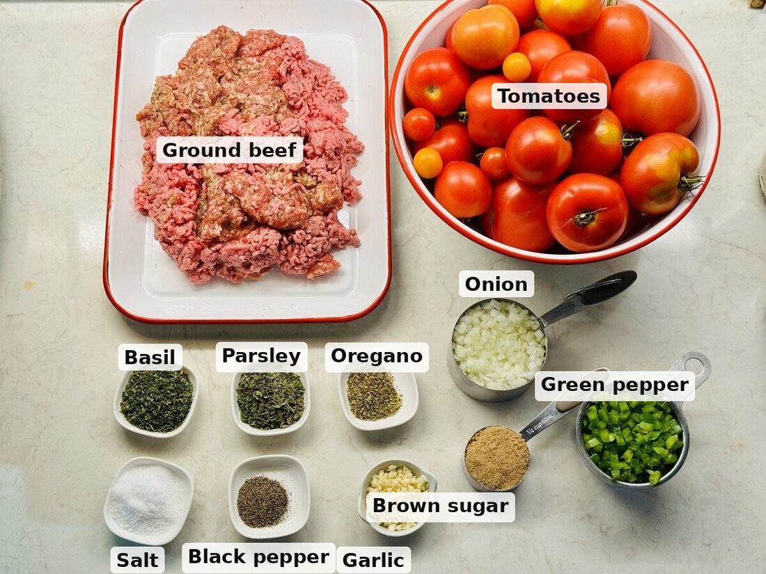 Labeled flat-lay of the ingredients: ground beef, tomatoes, basil, parsley, oregano, salt, black pepper, garlic, onion, brown sugar, and green pepper