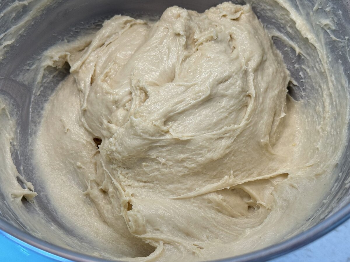 Smooth, glossy sourdough babka dough after kneading in a stand mixer
