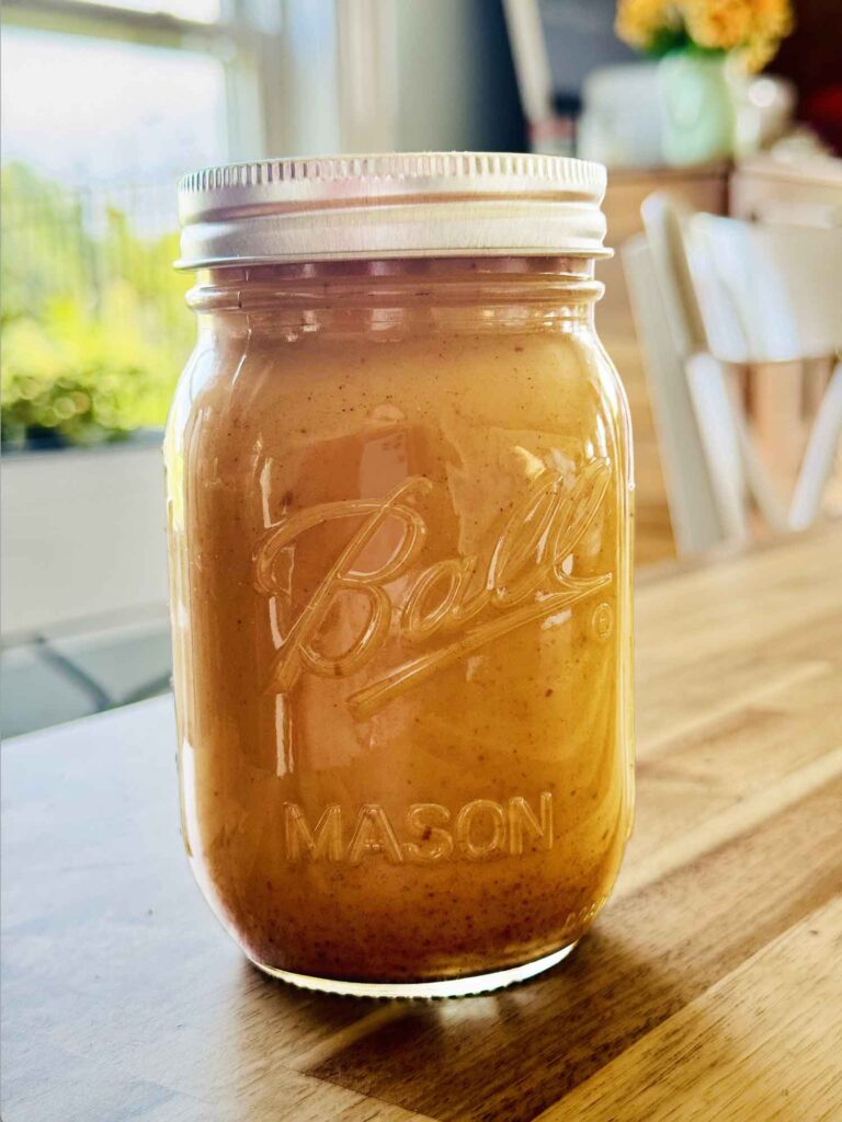 A big Mason jar full of pumpkin creamer