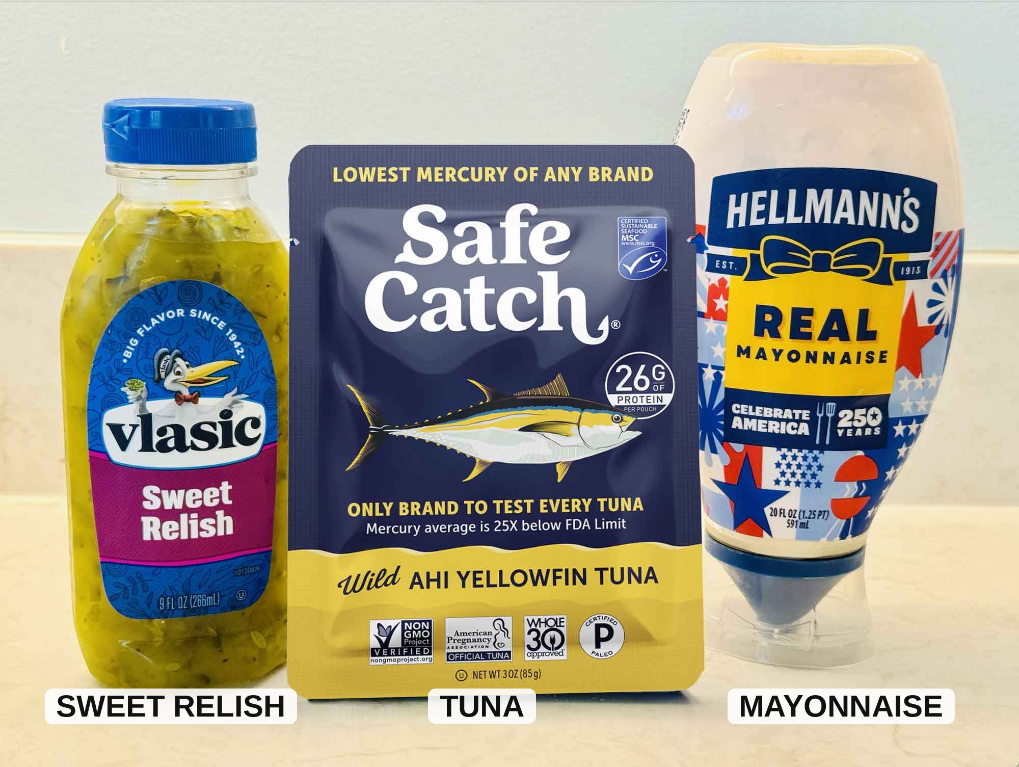 Three ingredients for quick tuna salad: a tuna packet, mayonnaise, and sweet relish