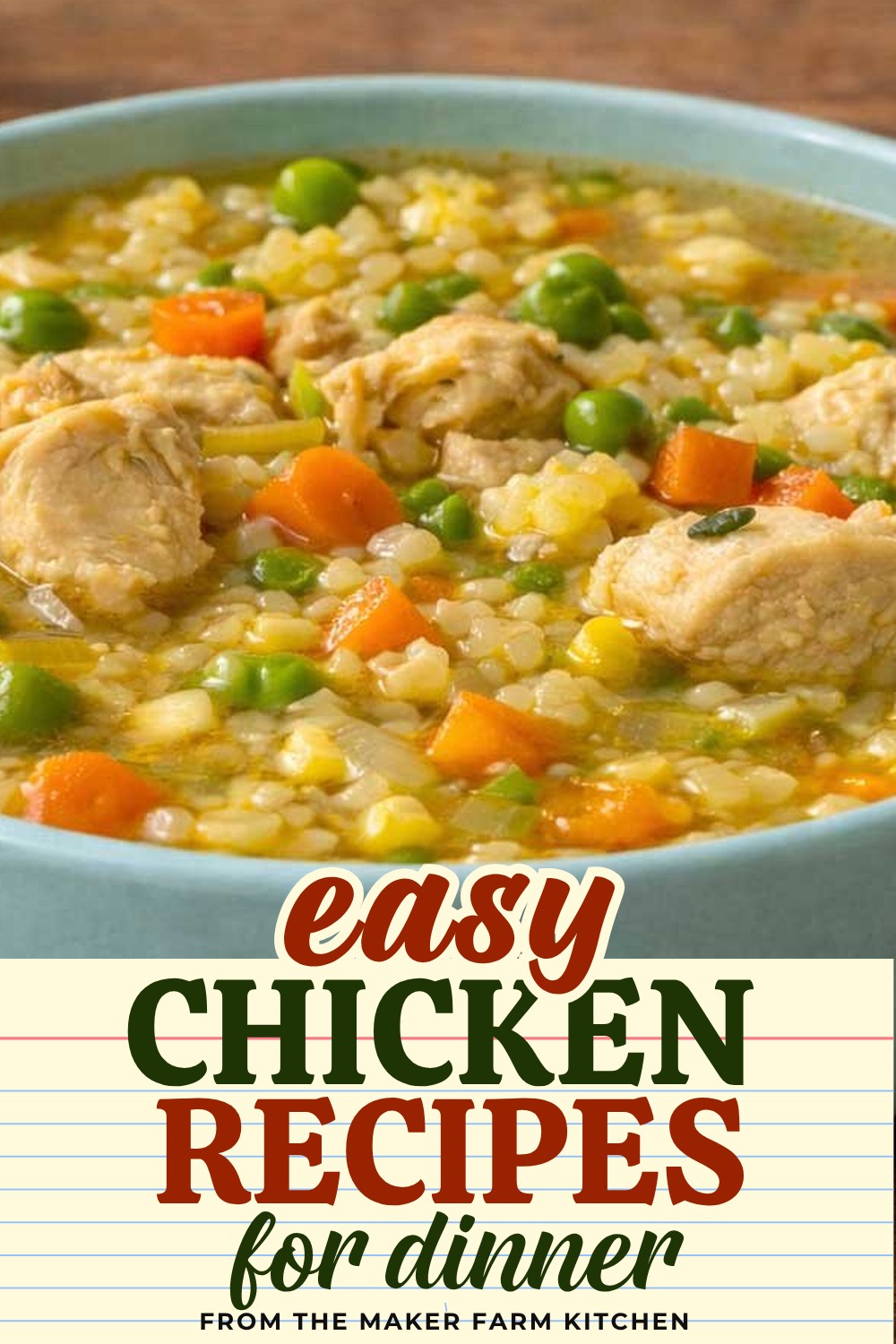 Homemade chicken soup with pearl couscous, carrots, and peas in a blue bowl