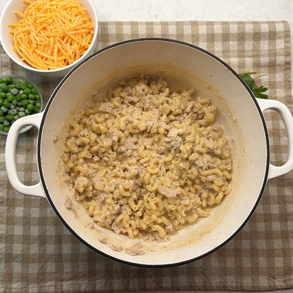 Creamy tuna pasta ready for the cheese and peas to be stirred in