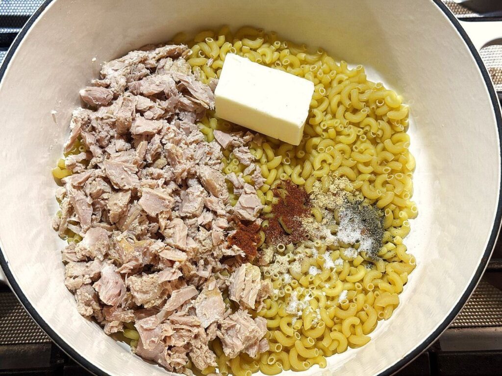Ingredients for creamy pasta in a pot, ready to cook