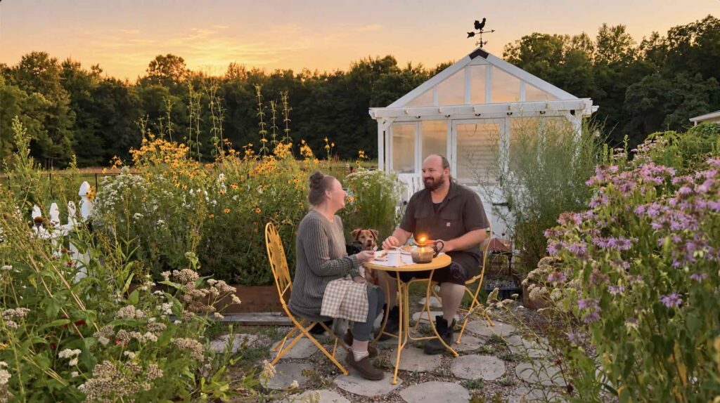 Jennifer and Greg eating marry me chicken in their cottage garden