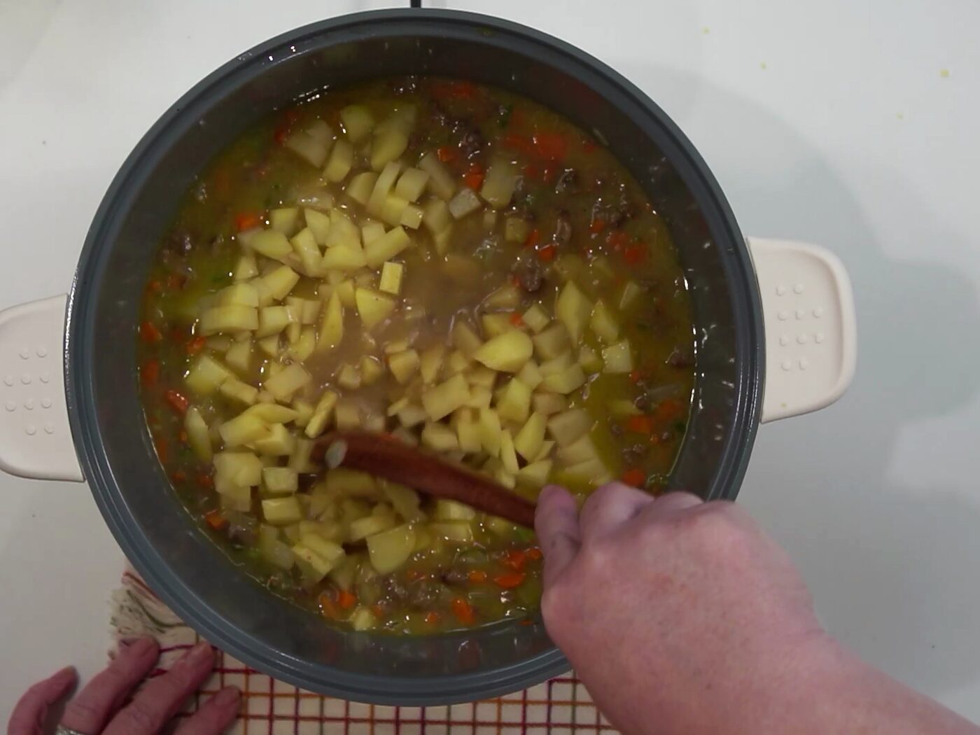 Diced potatoes stirred into the brothy beef and vegetable soup