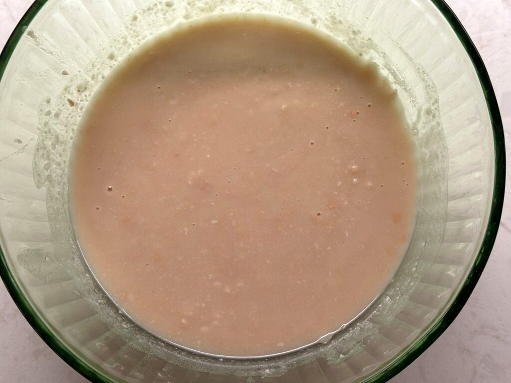 A smooth, creamy bean purée in a glass bowl