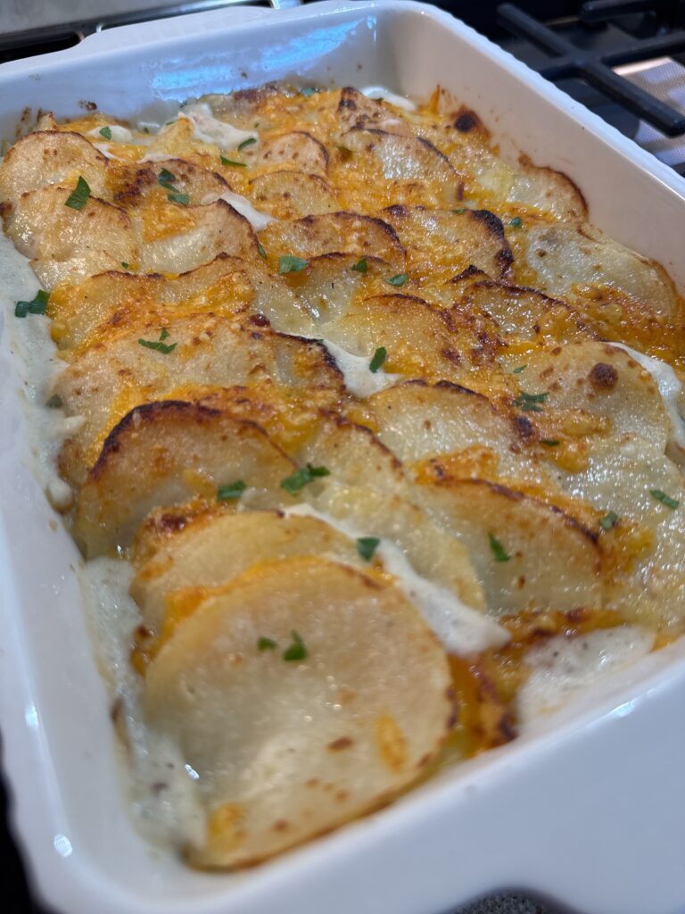An unedited photo of my scalloped potatoes resting on my stove